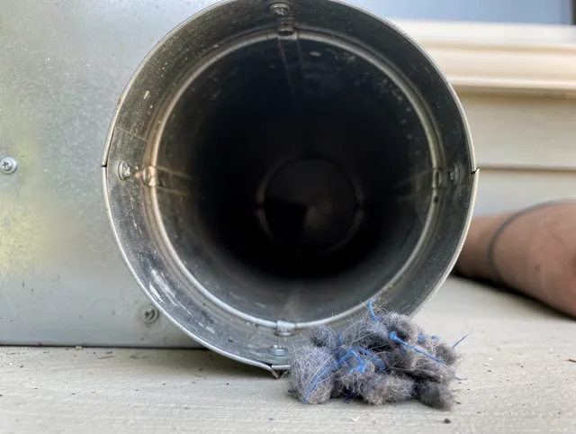 Winthrop Dryer Vent Cleaning technician using specialized equipment to clear severe dryer vent blockage in Winthrop